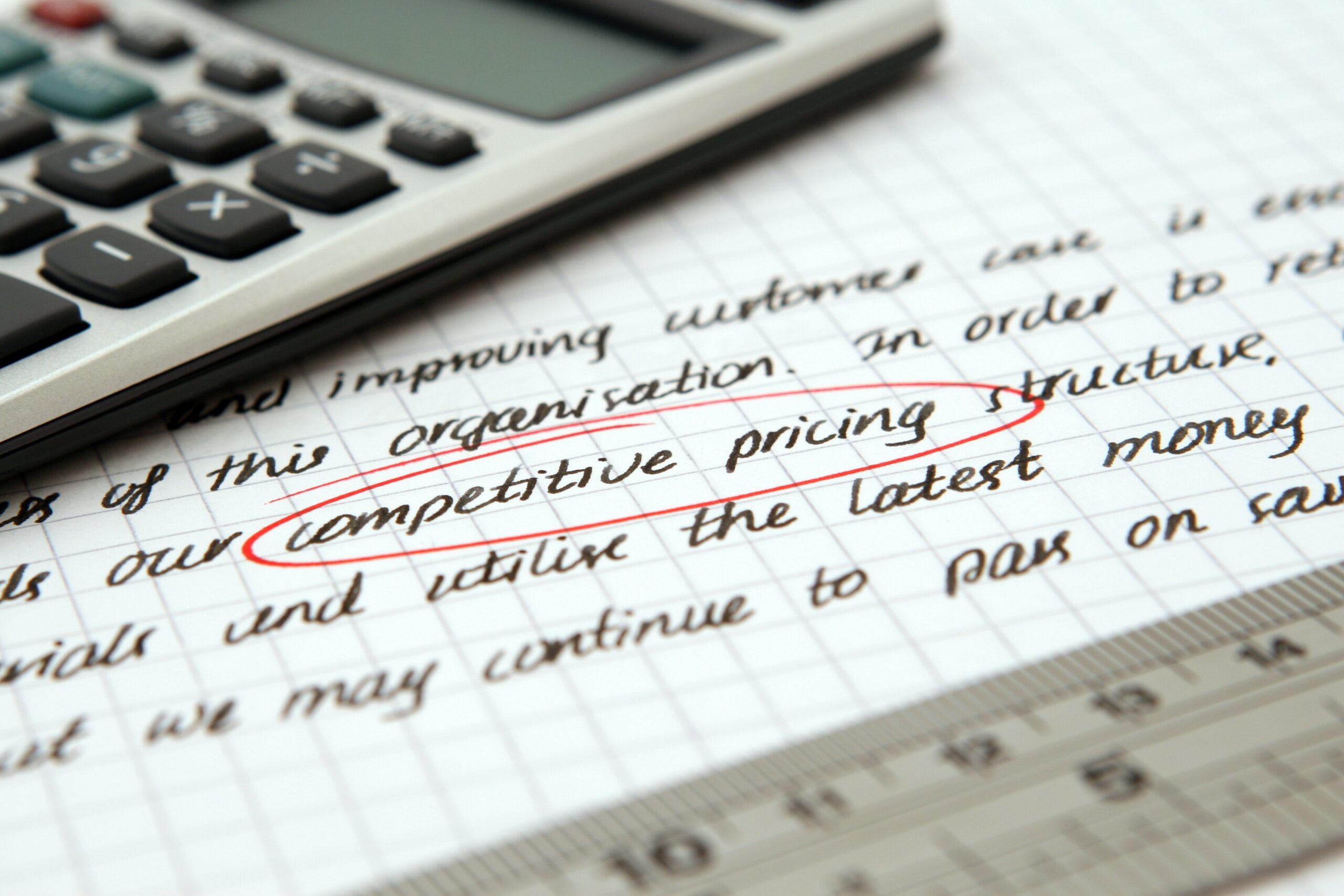 image of text with a calculator on top and competitive pricing circled in red.