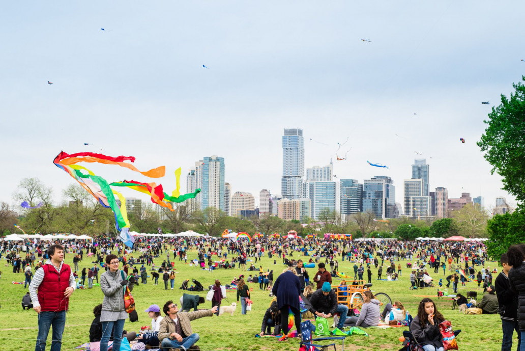 Image of Zilker Park Kite Festival with tons of locals and visitors.