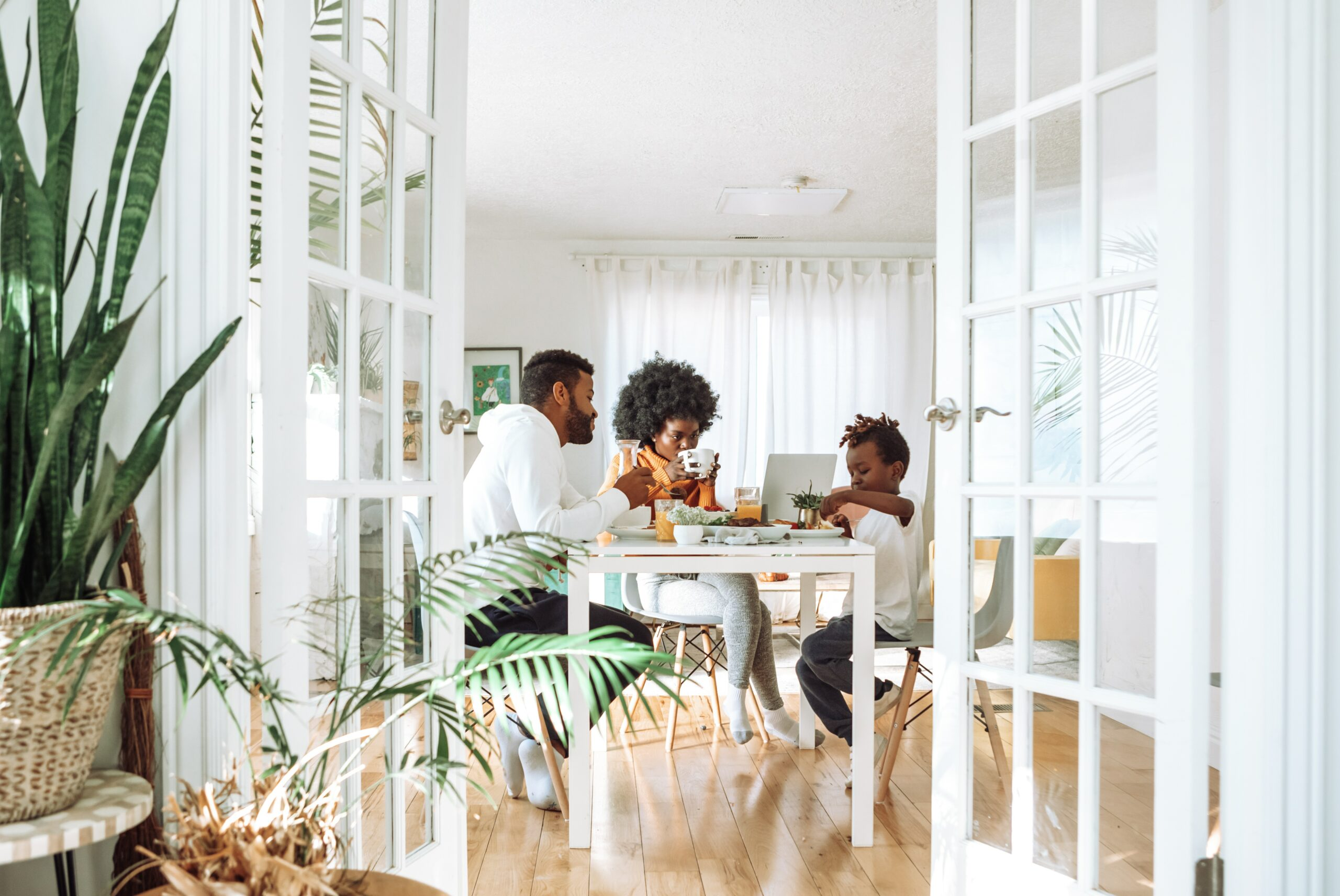 Image of a family sitting in a short term rental dining room